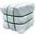 Bale wrapped in white plastic with green straps
