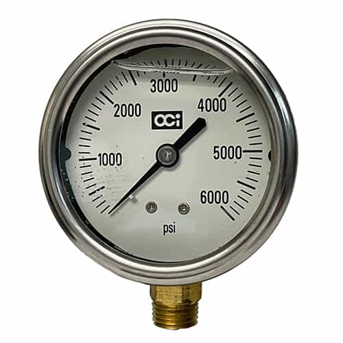 white face pressure gauge with numbers from 0 to 6000 psi