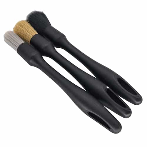three detailing brushes with black handles